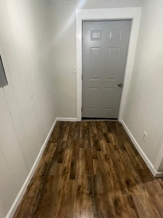 doorway to outside with dark wood-type flooring