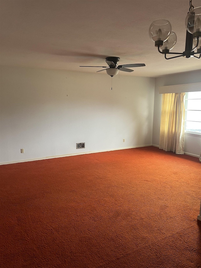 empty room featuring ceiling fan and carpet flooring