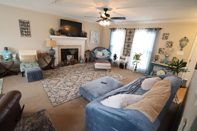 living room featuring crown molding, ceiling fan, and carpet flooring