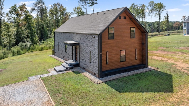 view of side of property with a yard