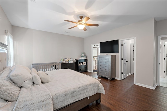 bedroom with ceiling fan and dark hardwood / wood-style flooring