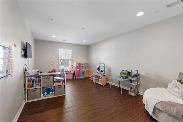 game room with dark hardwood / wood-style flooring