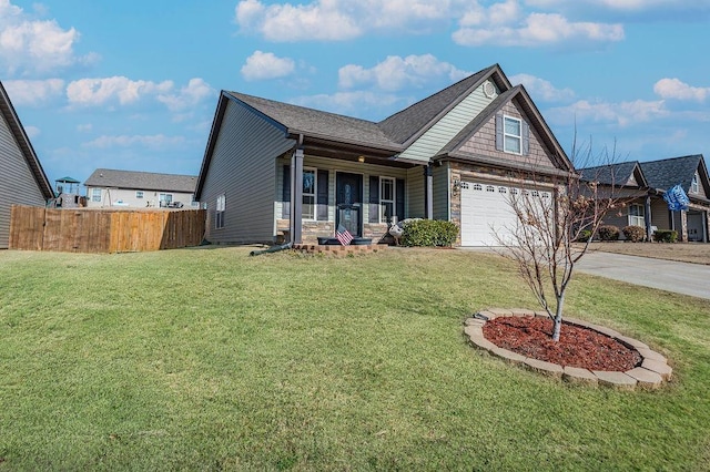 view of front of property with a porch, a garage, and a front yard