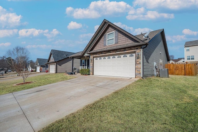 view of front of house featuring a garage, a front yard, and cooling unit