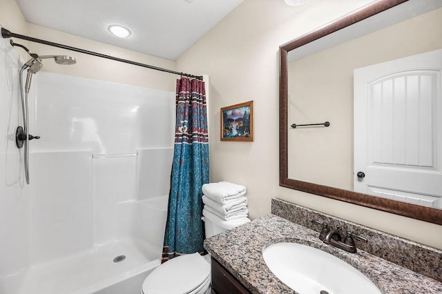 bathroom featuring vanity, a shower with curtain, and toilet