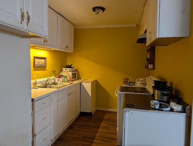 kitchen with dark hardwood / wood-style floors, white cabinetry, sink, range, and crown molding