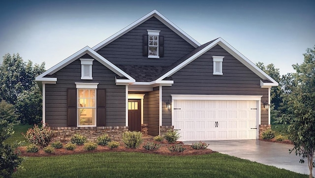 craftsman inspired home featuring a garage and a front yard