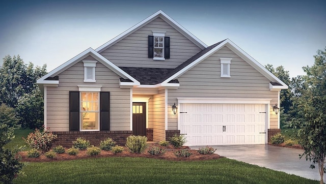 view of front of home with a garage and a front lawn