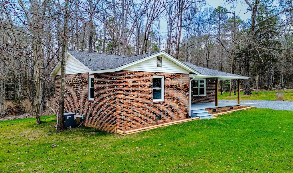 view of home's exterior with a yard