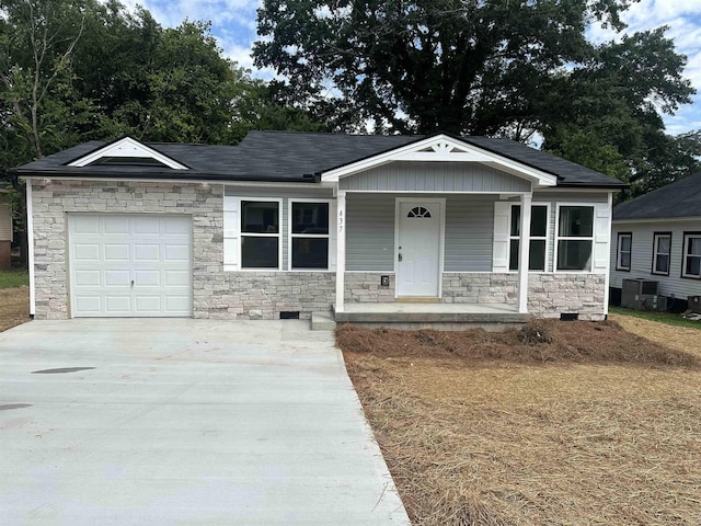 view of front of property featuring a garage and a porch