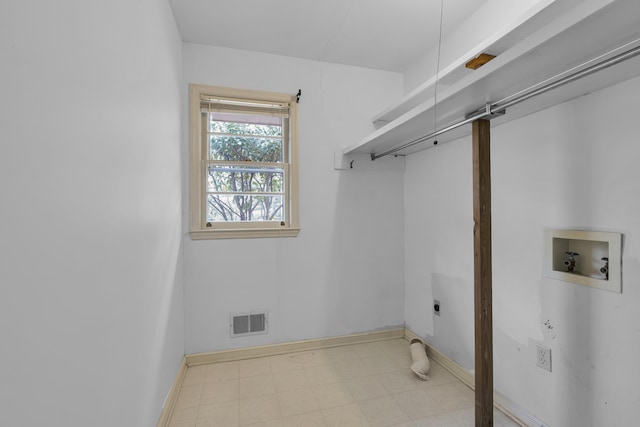 laundry area with hookup for a washing machine and hookup for an electric dryer