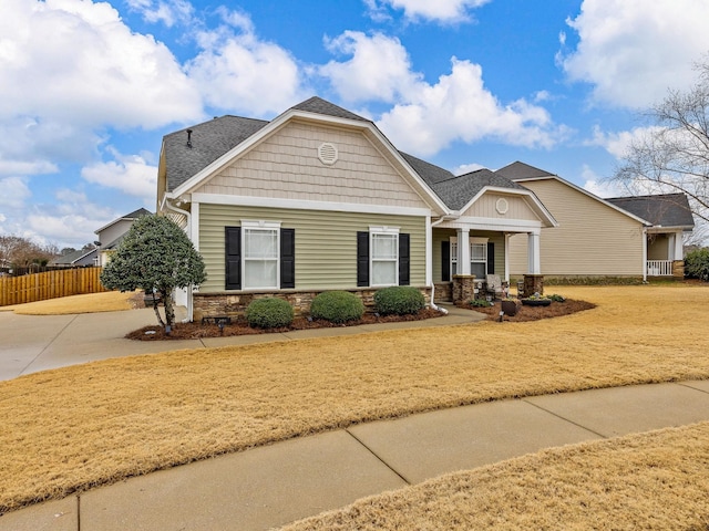 craftsman inspired home featuring covered porch