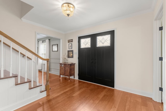 entryway featuring crown molding and wood-type flooring