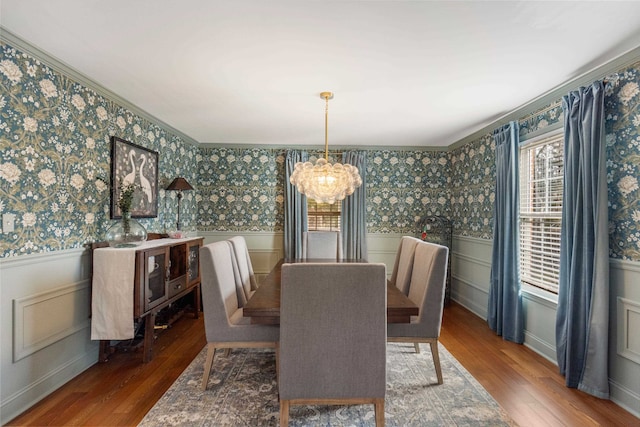 dining room with an inviting chandelier and hardwood / wood-style floors