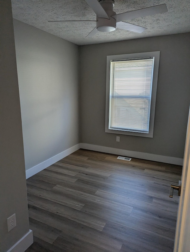 unfurnished room featuring ceiling fan, a textured ceiling, and hardwood / wood-style floors