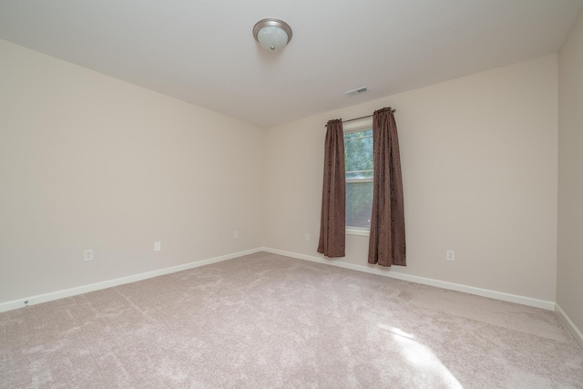 unfurnished room featuring carpet flooring