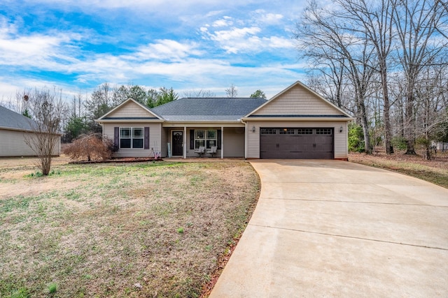 ranch-style house with a garage and a front yard