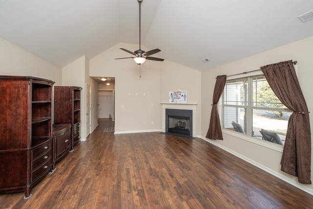 unfurnished living room with ceiling fan, dark hardwood / wood-style flooring, and high vaulted ceiling