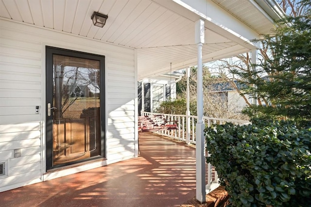 property entrance featuring covered porch