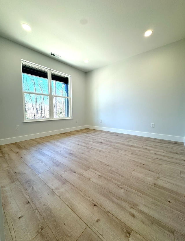 empty room featuring light hardwood / wood-style floors