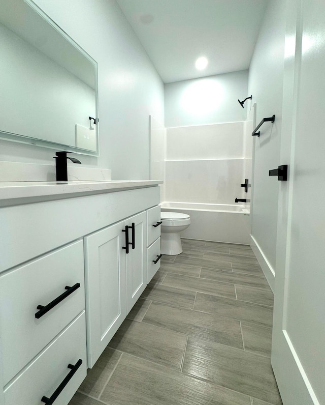 full bathroom featuring vanity, shower / bathtub combination, and toilet