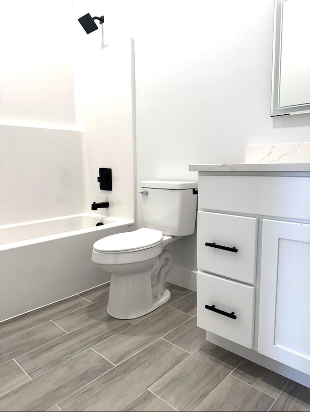 full bathroom featuring toilet, vanity, and shower / bathing tub combination