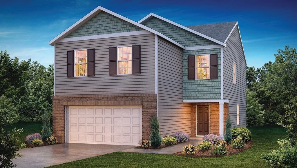 1915 Gracie, Woodruff, SC 29388 - view of front of house with a garage and a front yard