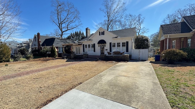 bungalow-style house featuring a front yard