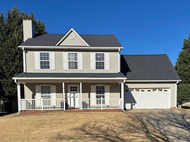 view of front facade featuring a porch, a garage, and a front lawn