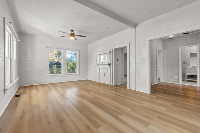 unfurnished living room with ceiling fan and light wood-type flooring