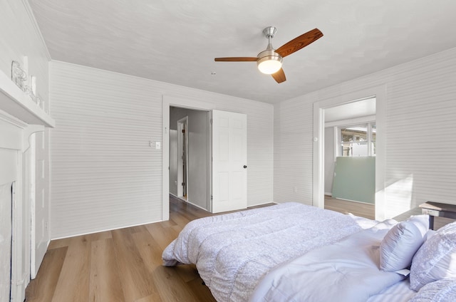 bedroom with ceiling fan and light wood-type flooring