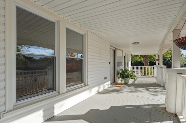 wooden deck featuring covered porch