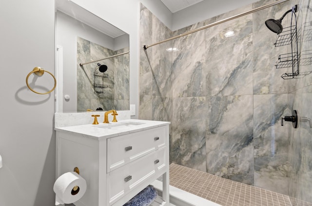 bathroom with vanity and tiled shower