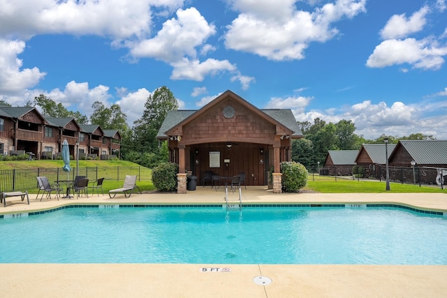 view of pool with a yard and a patio area