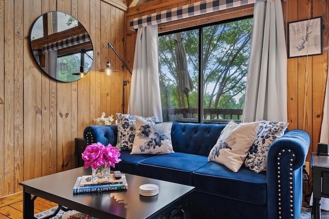 living room featuring wood walls