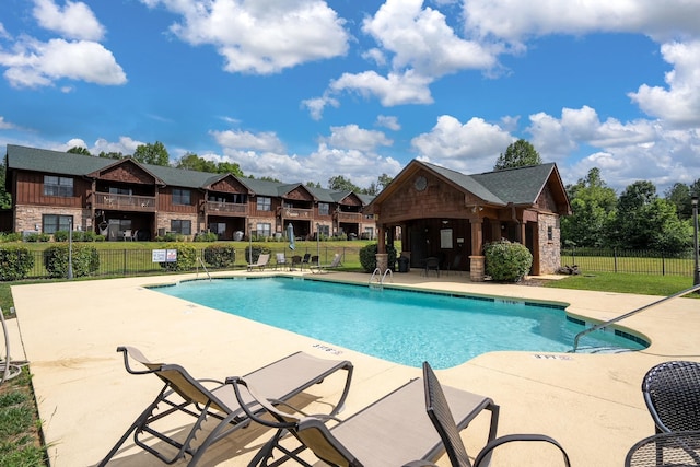 view of pool featuring a patio