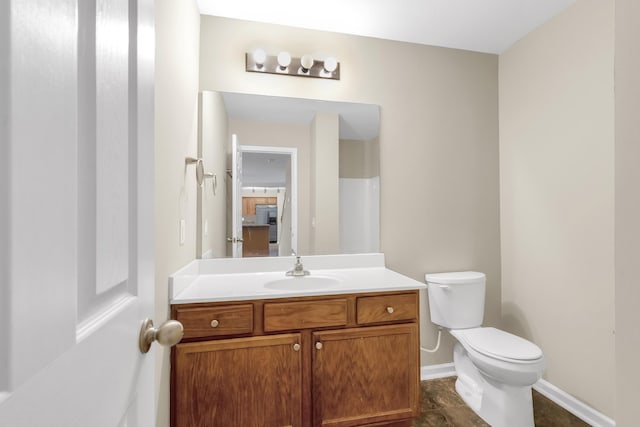 bathroom with vanity and toilet