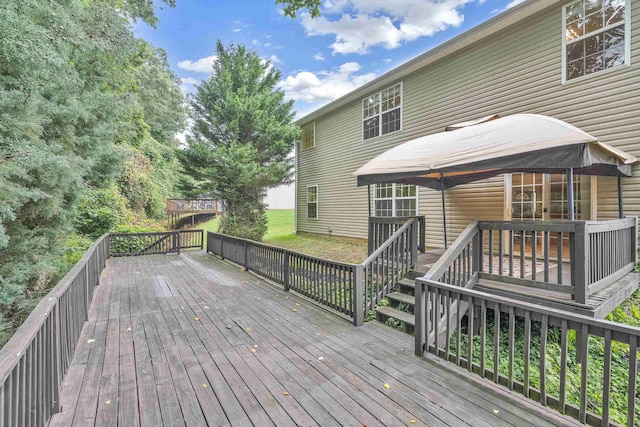 wooden deck featuring a gazebo