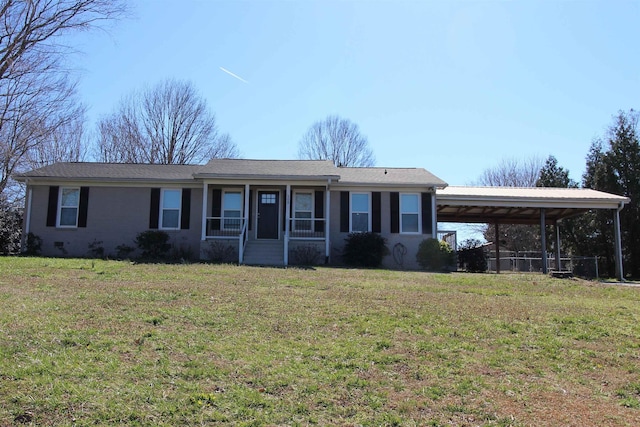 ranch-style house with a carport and a front lawn