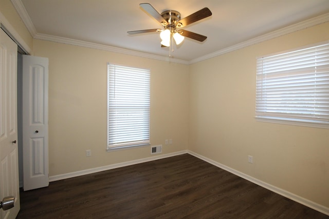 spare room featuring ceiling fan, ornamental molding, and dark hardwood / wood-style flooring