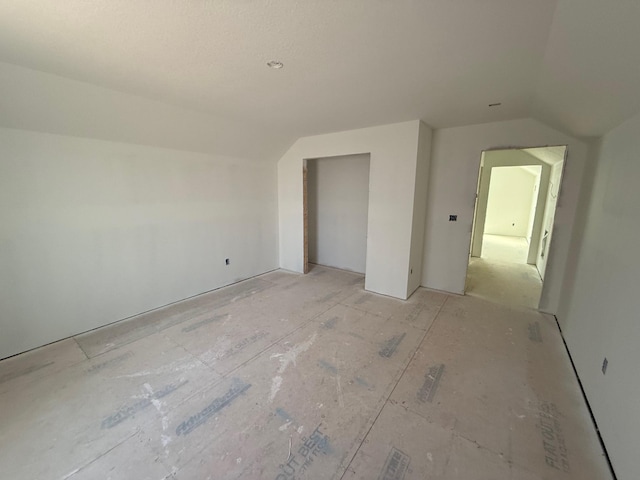 interior space with lofted ceiling and a closet