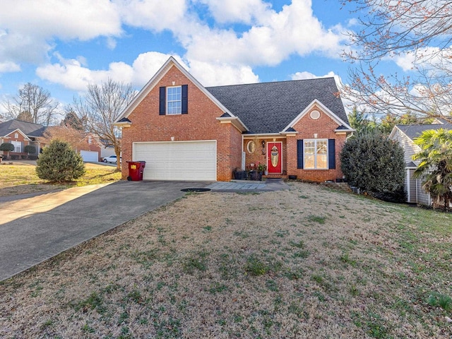 front of property featuring a garage and a front yard