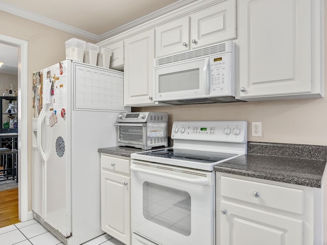 kitchen with white cabinetry, light tile patterned floors, white appliances, and ornamental molding