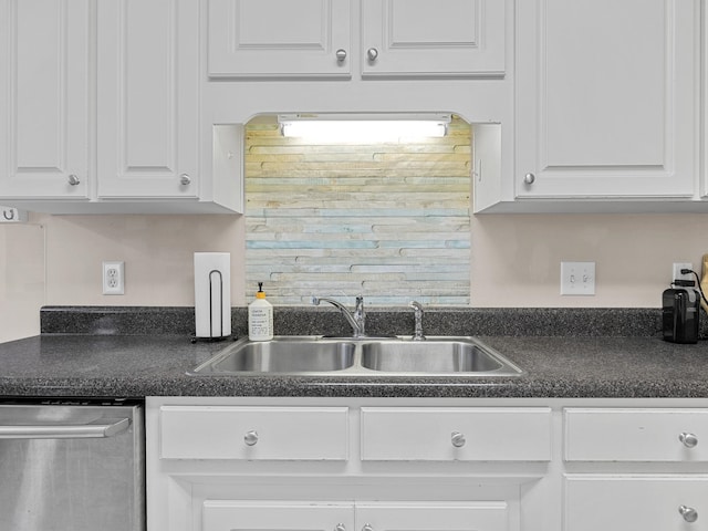 kitchen with sink, stainless steel dishwasher, and white cabinets