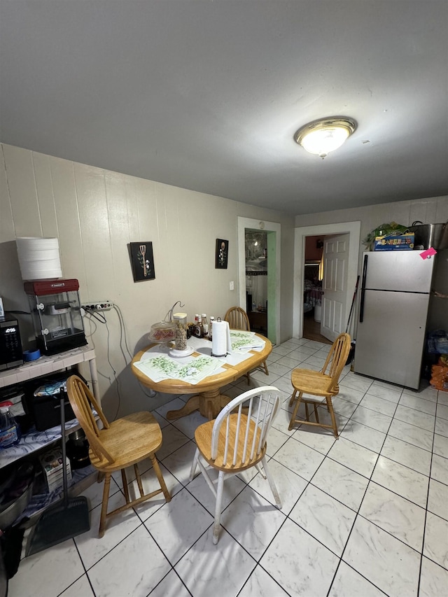 dining area with light tile patterned flooring