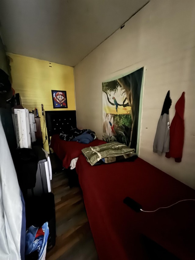 bedroom featuring dark wood-type flooring