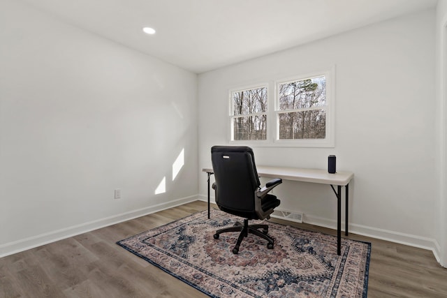 home office with hardwood / wood-style floors