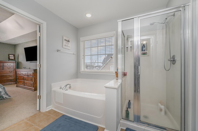 bathroom featuring independent shower and bath and tile patterned floors
