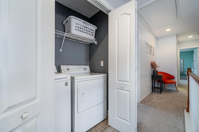 laundry area featuring separate washer and dryer and light colored carpet