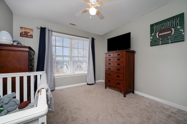 bedroom with ceiling fan, light carpet, and lofted ceiling